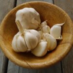 heads of garlic in a bowl